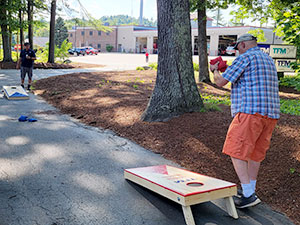 TFM Celebrates Friday with a Party and Cornhole Tournament!